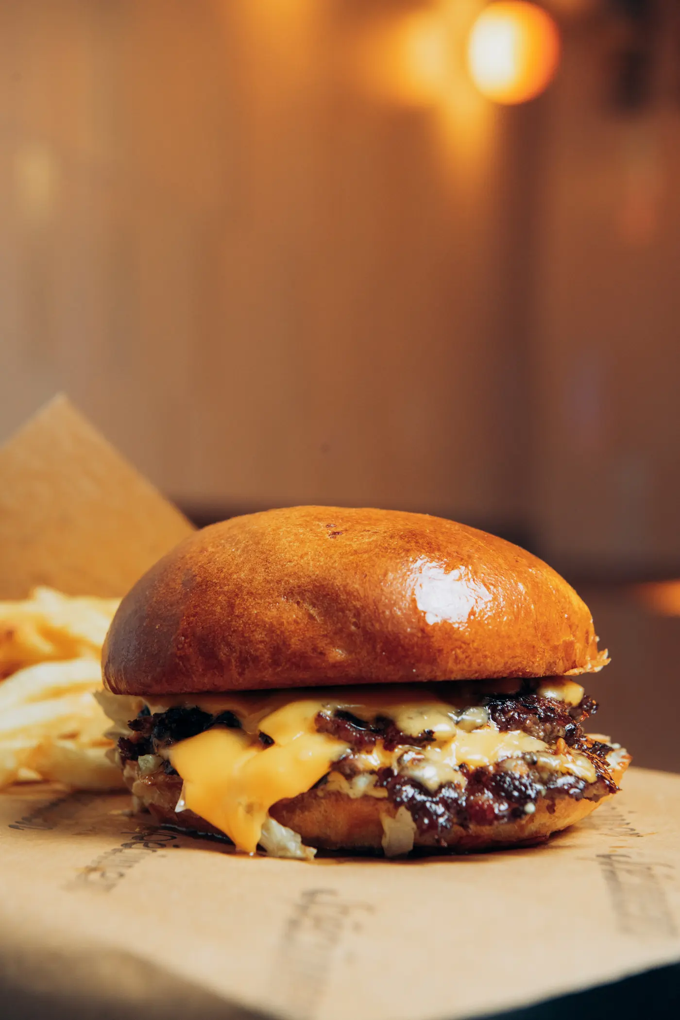 Spécimen’s double cheeseburger: melted cheddar over two smashed patties, house fries on the side